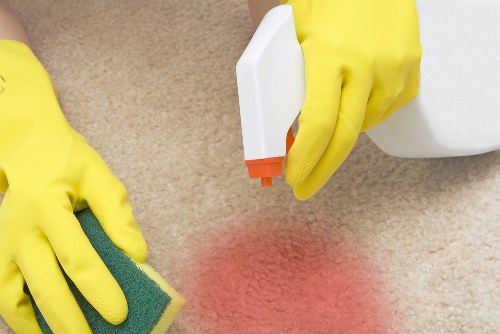 Professional oven cleaner in Westminster cleaning a greasy oven interior